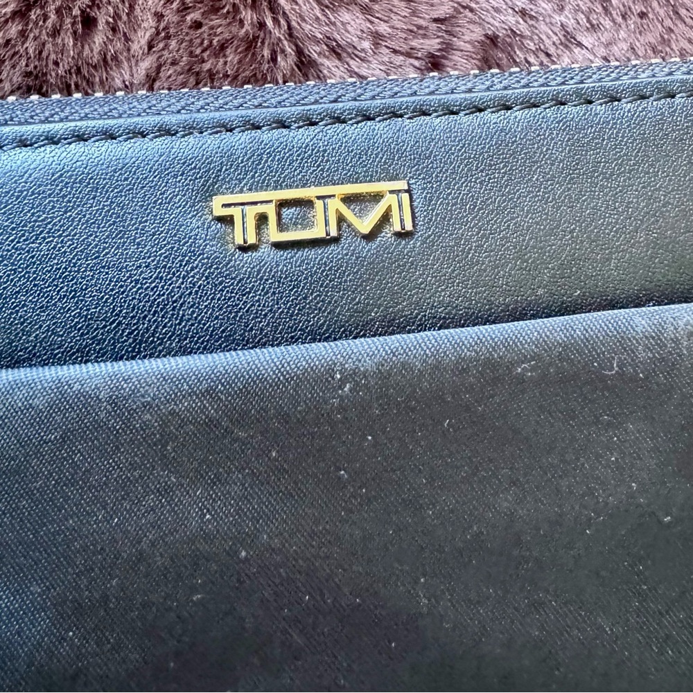 Tumi Black Zip Around Wallet with Gold Accent